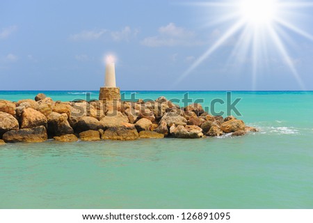 Picture of a lighthouse in the sea sunny bright day