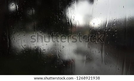 Natural water drop on glass Royalty-Free Stock Photo #1268921938
