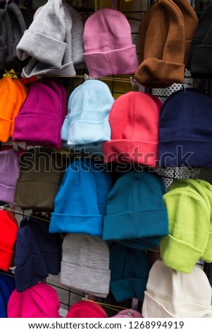 colorful knit winter berets in the shop. hat concept.