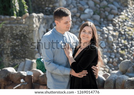 Young couple in love on the background of the fountain