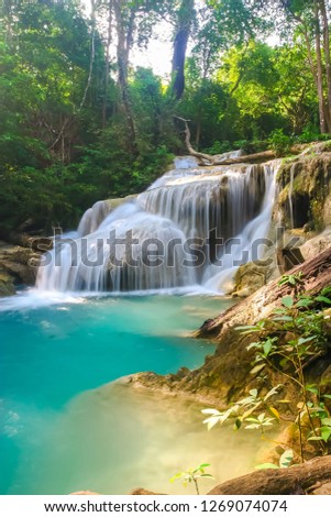 The beautiful Erawan cascade waterfall with turquoise water like heaven at the tropical forest ,Kanchanaburi Nation Park, Thailand