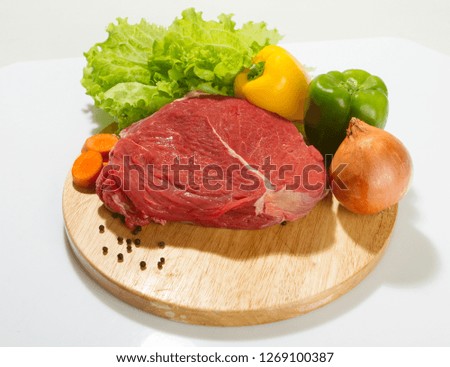 Various pieces of raw meat loin.