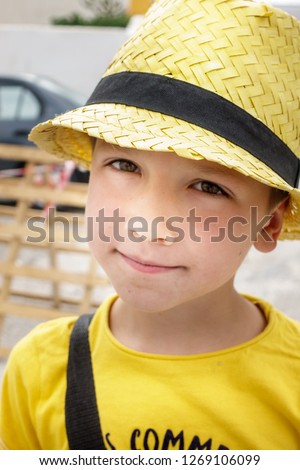 Portrait of boy in sun hat