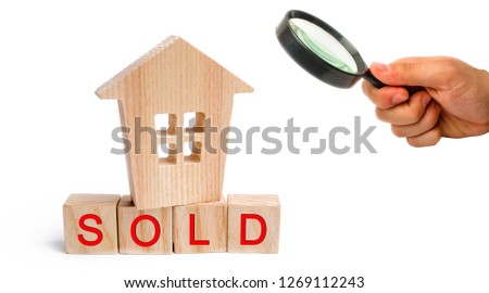 wooden house with the inscription sold on white isolated background. sale of property, home. affordable housing. sale of apartments. real estate agent services. realtor