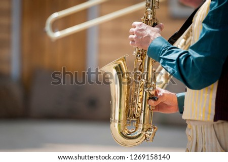 Close up on hands of a saxophonist