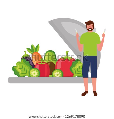 bearded man with fresh vegetables and fork knife