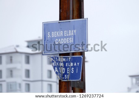 street sign on the pole, deformed,