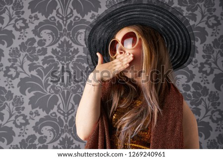 Funny kid dress like adult costume in retro wallpaper with hat