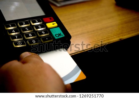 Making Payment with Credit card on the pos machine close up view