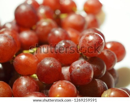 Ripe red wet grape with water drops 
