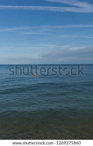 Bright blue sea on a clear sunny day with gulls