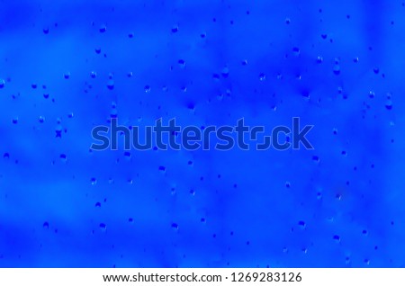 Closeup of a blue liquid, water, background image.