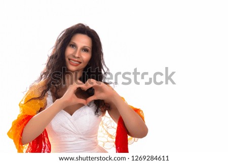 girl with Middle Eastern somatic features making heart sign with hands