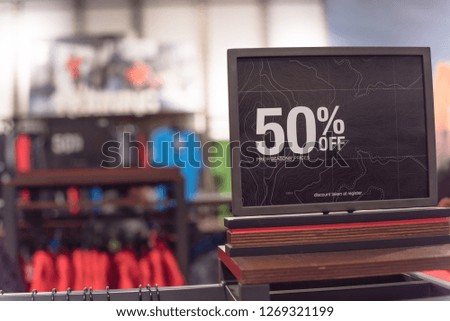 Red tag sale 50 percent discount at outdoor department store in Texas, USA. Big reductions concept for Black Friday and Holiday season sale of outerwear and gear. Business fashion and advertisement