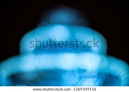 Blue bokeh blurred lights background. Garlands decoration for the new year celebration.