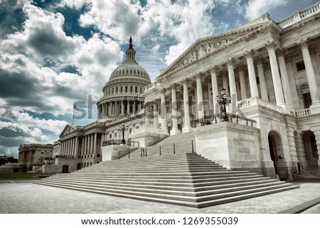 Stark cloudy weather over empty exterior view of the US Capitol Building in Washington DC, USA Royalty-Free Stock Photo #1269355039