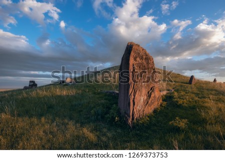 Stone in steppe Khakasia. Royalty-Free Stock Photo #1269373753