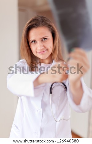 Friendly doctor stares x-ray scan