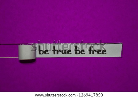Be True Be Free, Inspiration, Motivation and business concept on purple torn paper