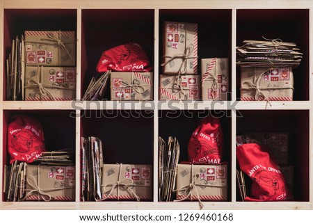 Christmas letters and presents on shelves