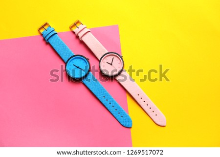 Composition with stylish wrist watches on color background, flat lay. Fashion accessory