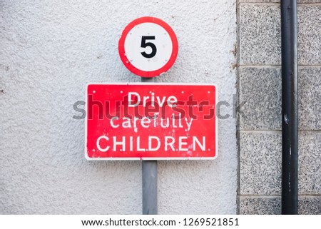 5 mph road sign post at school for safety of children
