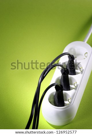 Closeup picture of a white outlet isolated on blue.