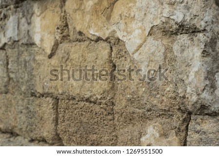 yellow old stone wall soft focus perspective foreshortening background material texture surface