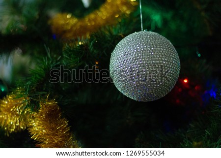 Background for design, texture Christmas decoration on the spruce.