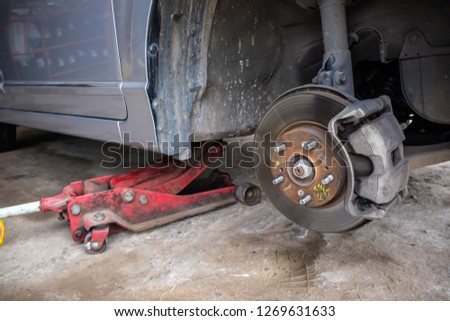 Car disk brake repair in garage, Wheel brake system
