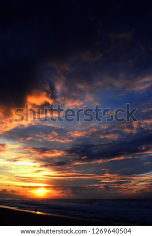 USA, Hawaii, Oahu, North Shore, Banzai Beach, photographer photographing woman at sunset