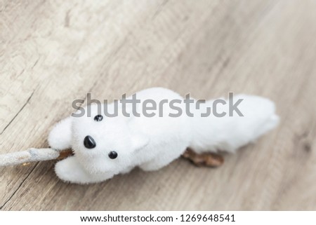 A white toy squirrel