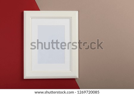 white frame on red and gray background