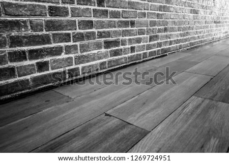 Rough old brick wall texture background and a wood floor