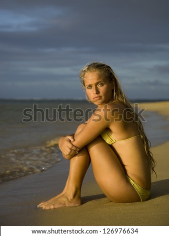Soft focus portrait of a teenage girl sitting on the beach