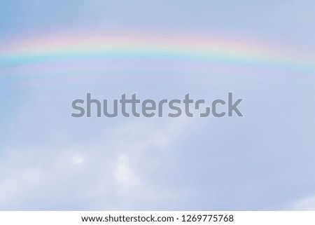 Blurred images,Rainbow images in the air with beautiful colors caused by rain clouds and water droplets that reflect light from the sun, showing the colors of the rainbow with many colors.