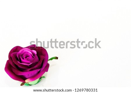 pictured in the photo beautiful large artificial purple rose view side