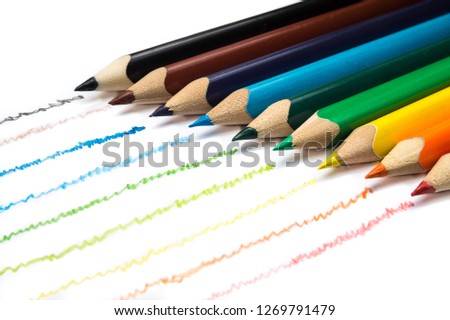Colorful wooden pencils in row on white background