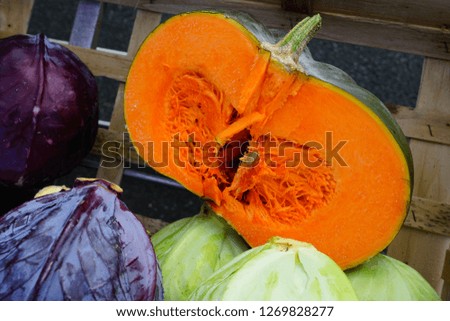 Colorful pumpkins and squashes at a winter farmers market
