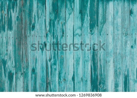gray green wooden background of old worn boards in the wall of the fence