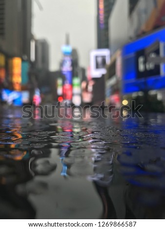 Blurred city lights in rainy day.