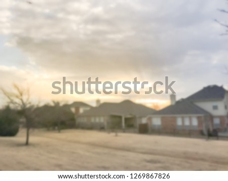 Motion blurred sunset at backyard of typical single-family house in Texas, America