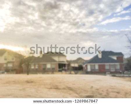 Motion blurred sunset at backyard of typical single-family house in Texas, America