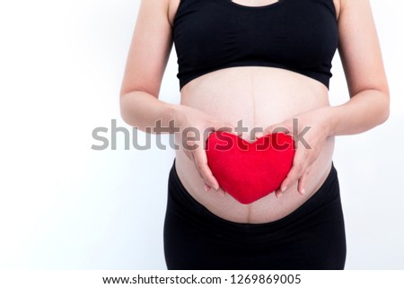 Close-up pictures of pregnant Asian women with red heart on a white background