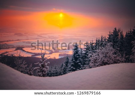 Sunrise in winter landscape