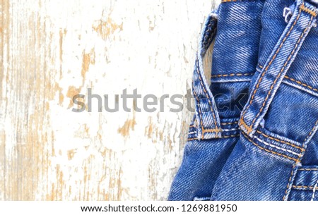 Blue jeans on rustic wooden board. Logging for shop and sale - Image 