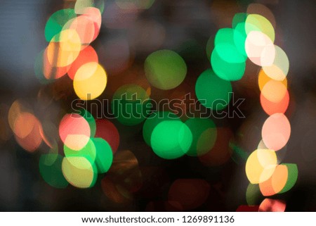 Colorful lights bokeh background, Christmas. Blurred and glowing lights. 