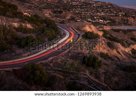 Long exposure photo of light streaks from cars driving along coastal Palos Verdes Drive, Rancho Palos Verdes, California