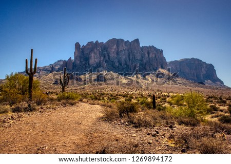 Iconic view of Superstition Mountains and Saguaro cacti in Lost Dutchman State Park, Arizona from Treasure Loop Trail Royalty-Free Stock Photo #1269894172