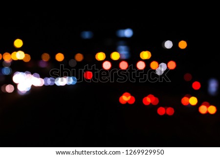 Out of focus traffic, defocus light background.  Colorful blurred background.